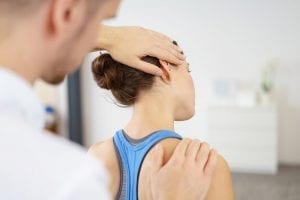A woman receiving osteopathy services.